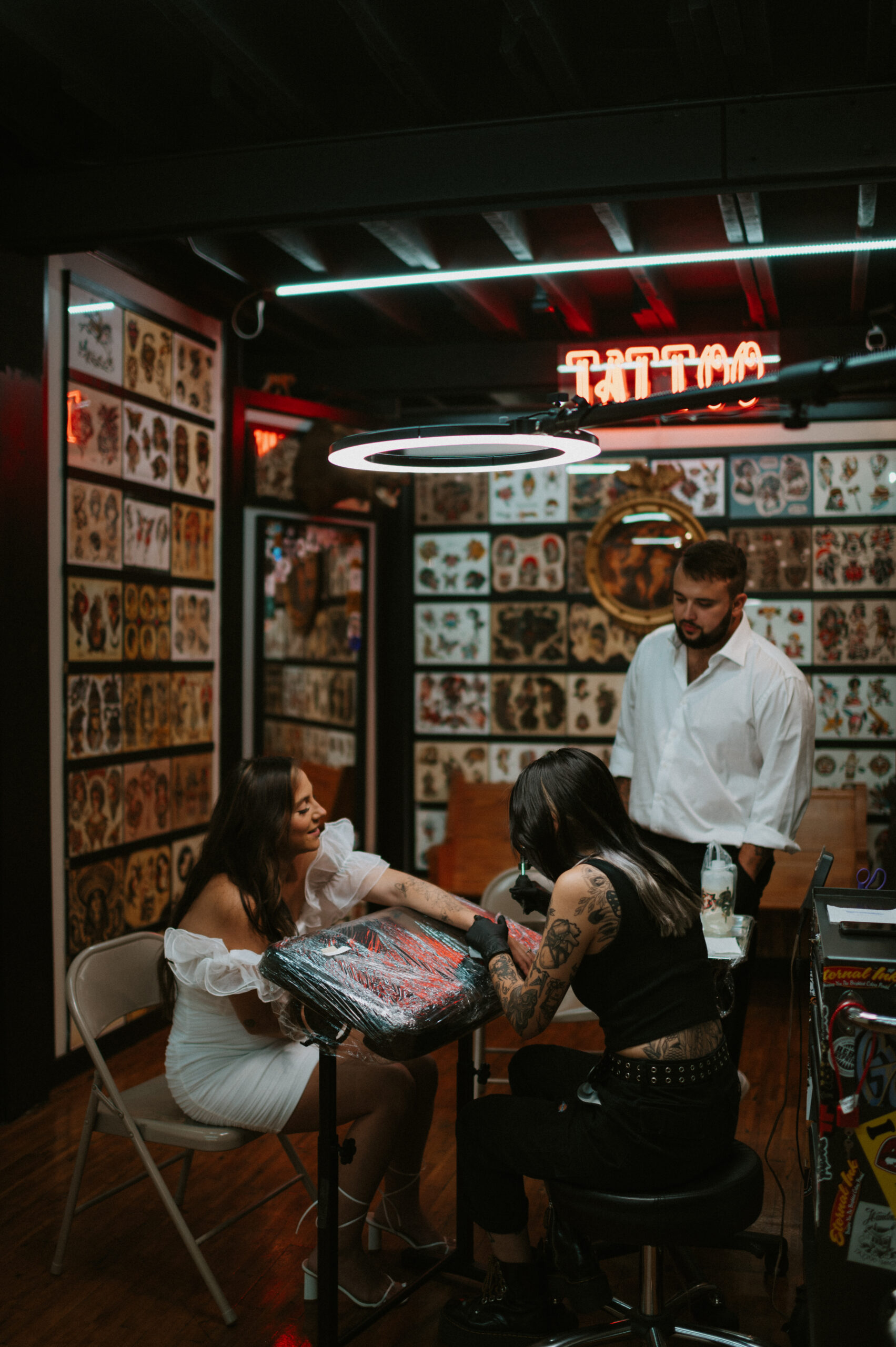 Couple getting tattoos for engagement session at Big cat tattoo in Atlanta GA