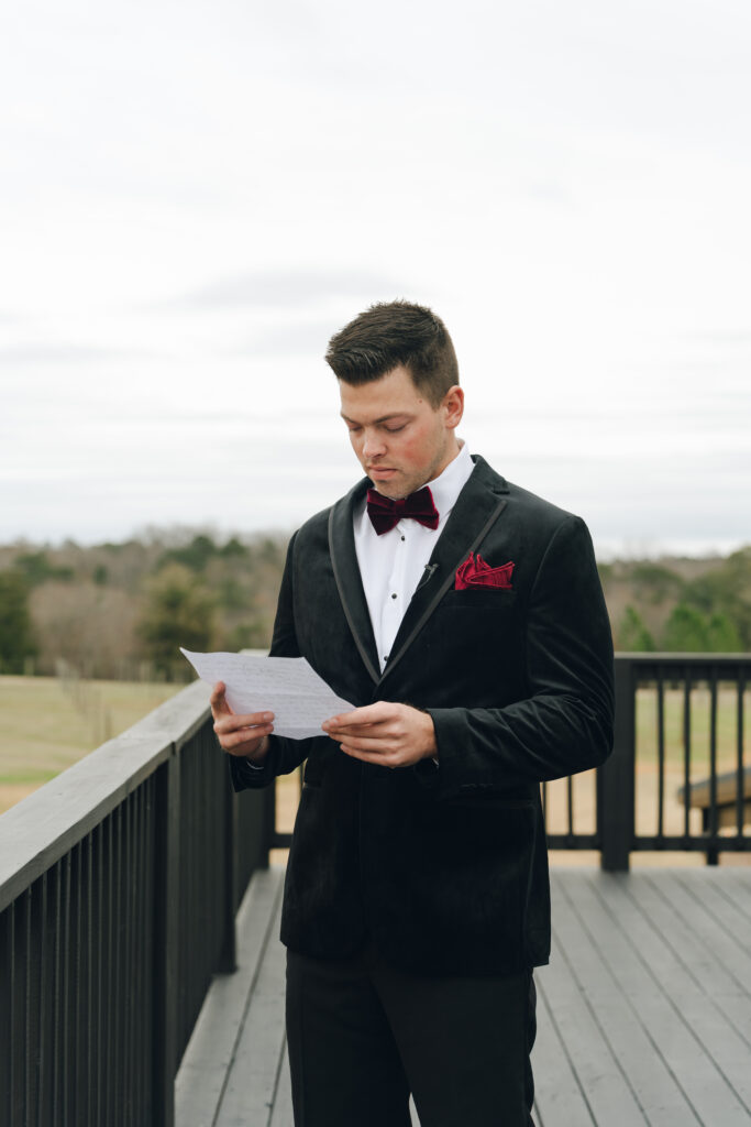 Groom reading letter from the bride privately before the wedding
