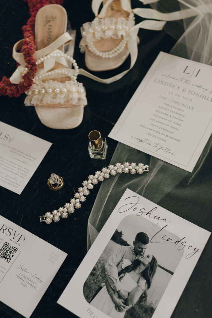 Wedding flat lay details with invites and shoes