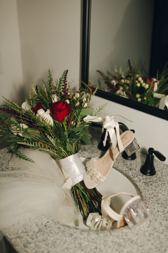 editorial detail photos of the bride's wedding shoes and bridal bouquet 