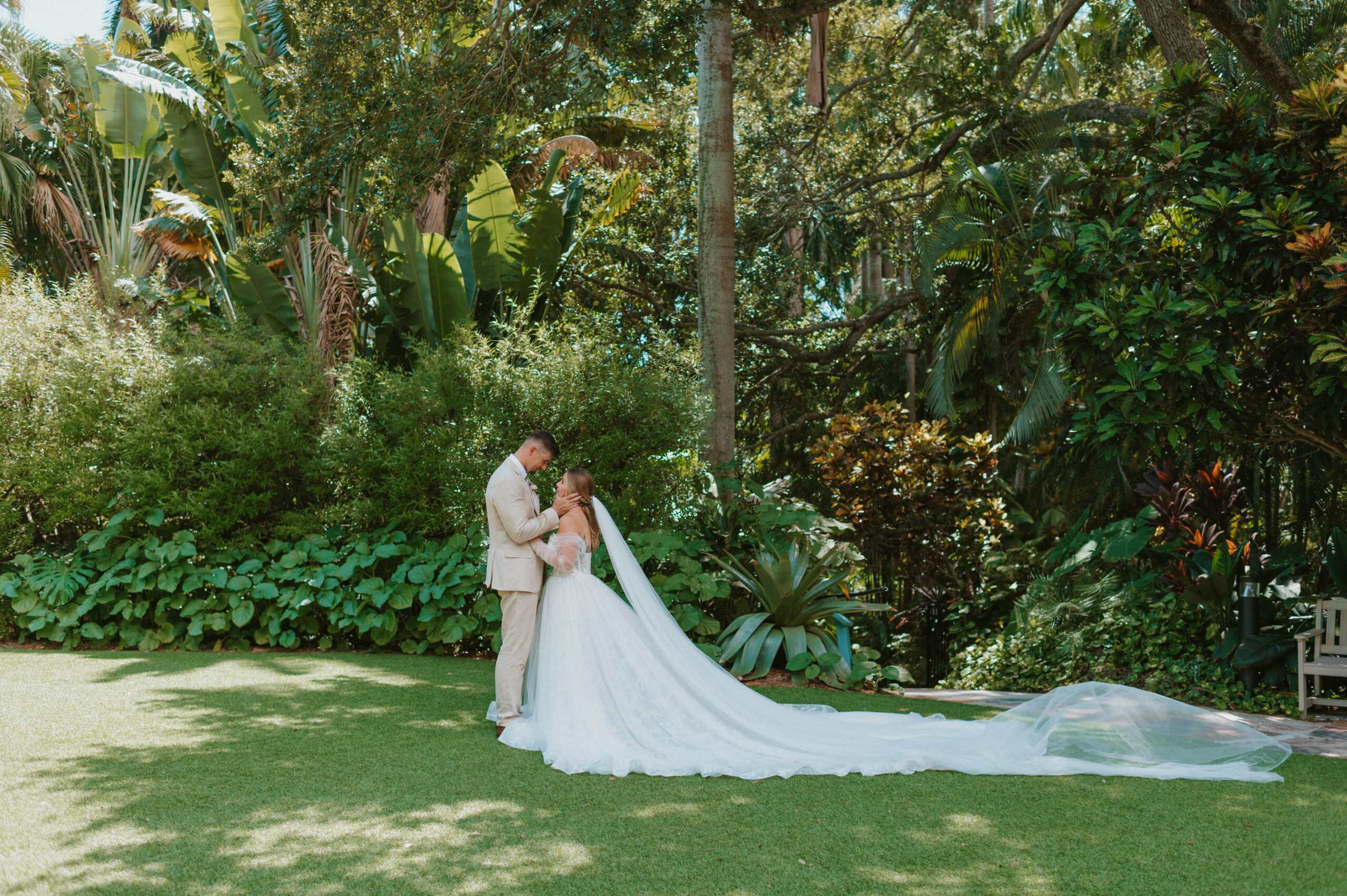 Newly married couple kissing in Hawaiian Rainforest